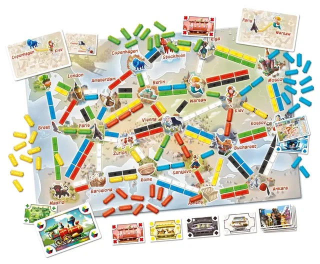 A First Journey game set up on the Europe map, with each player's trains and cards beside the board