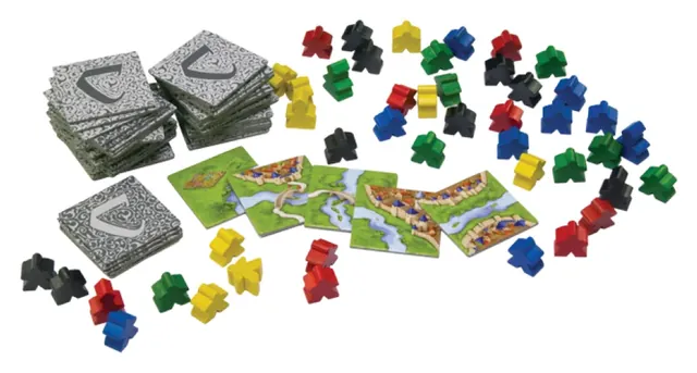 Stacks of square land tiles and a pile of wooden meeples in six colours