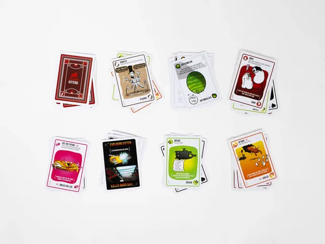 Pairs of cards laid out, showing the cartoon art of the Exploding Kitten, Defuse and action cards