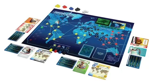 The Pandemic board laid out with role cards, pawns, research stations, disease cubes and card decks